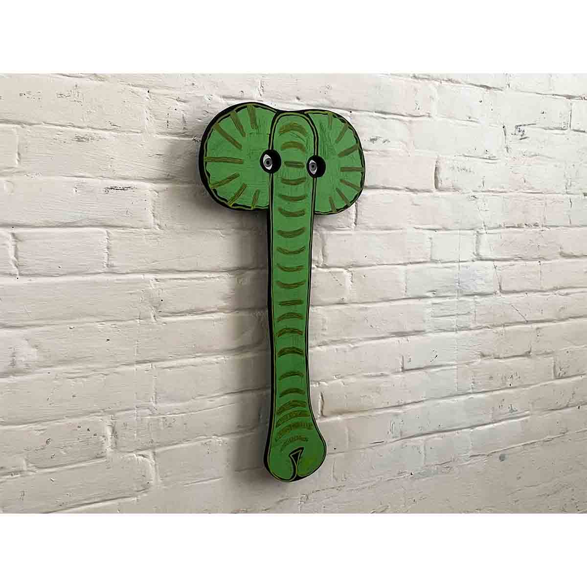 THERE IS A GREEN ELEPHANT IN THE ROOM